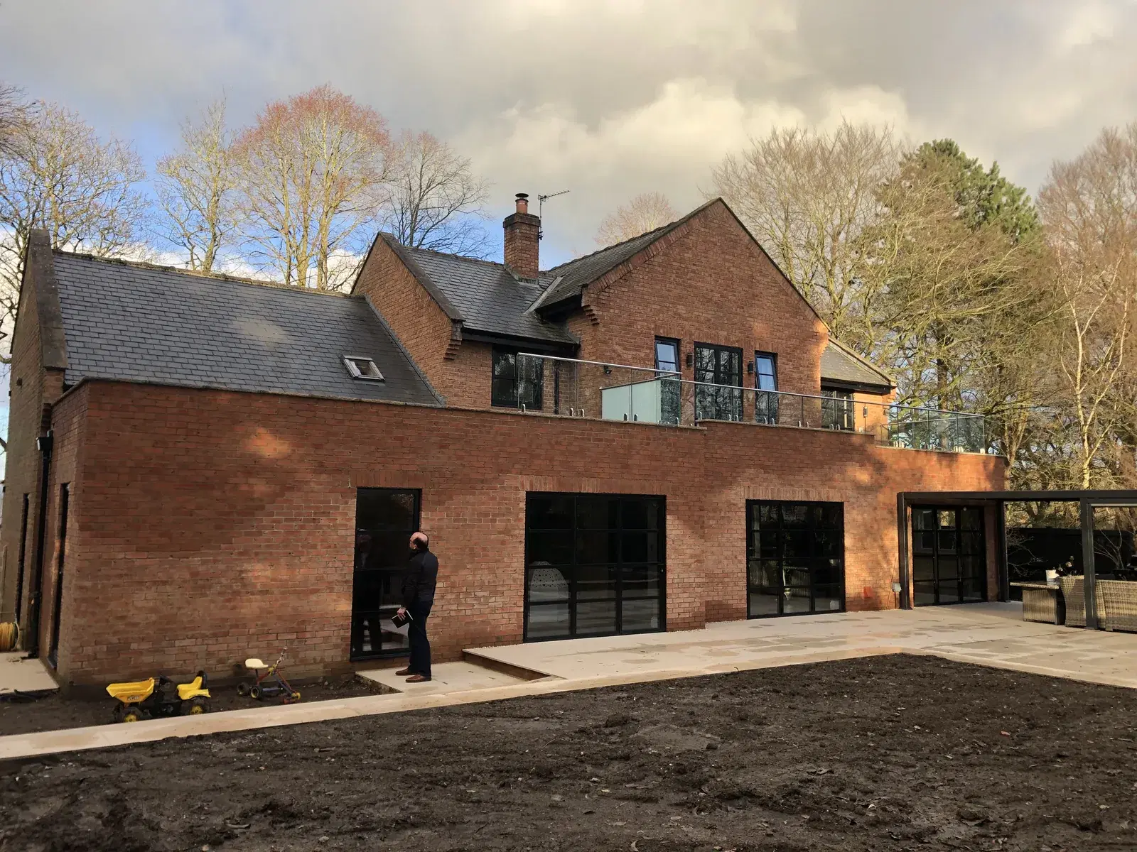 New windows and doors fitted to the rear of a house.