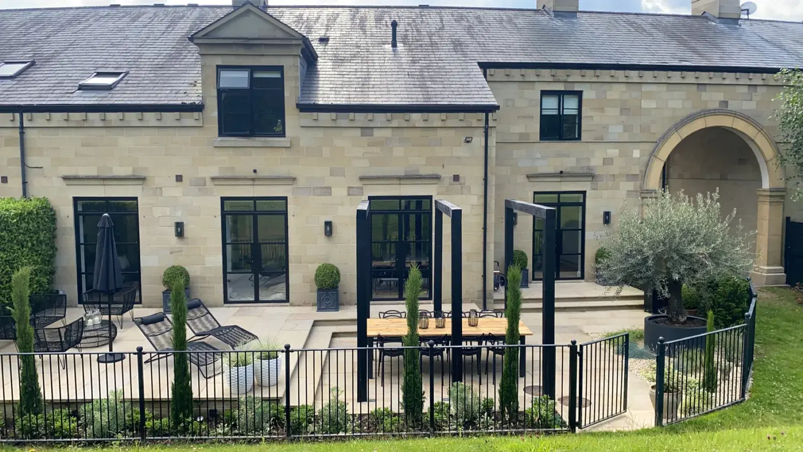 The same barn conversion, showing the full run of black framed glazing.